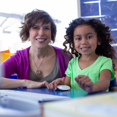 teacher and student smiling