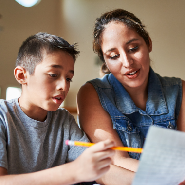 teacher and boy studyong